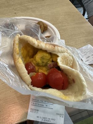 Gyro Pita (they give it to you with just the meat and you must fill it with toppings from salad bar yourself, I added cheese sauce instead of the garlic sauce)  at Vegan Love in Budapest