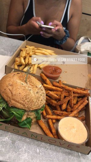 Jucy lucy burger with sweet patatoe fries  at Vegan Love in Budapest
