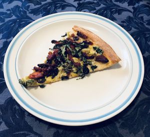 A slice of Aphrodite with vegan cheese  at Blue Line Pizza in Burlingame