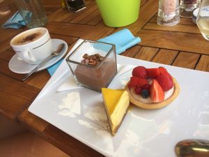 The mixed desert plate with an oat-cappuccino  at Eqvita in 