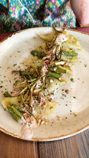 Ravioli filled with vegan cheese and asparagus, with walnut cream on the top at Rifugio Romano in Rome