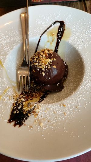 Baciami ancora dessert, filled with hazelnut semifreddo, salt caramel on a biscuit,  covered in rocher glaze at Rifugio Romano in Rome