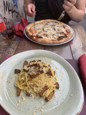 Vegan Carbonara and Vegan pizza with eggplant at Rifugio Romano in Rome