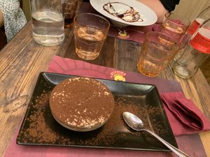 Delicious tiramisu and sad broken panna cotta! at Rifugio Romano in Rome