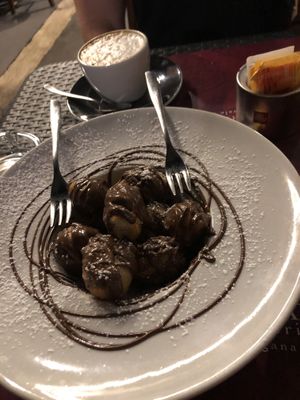 Pizza dumplings with Nutella, so good! at Rifugio Romano in Rome