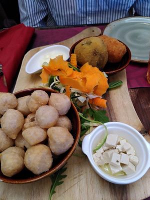 Vegan appetizer with one arancino, one supplì, marinated tofu, hummus+vegetables, mayo, fried pizza dough  at Rifugio Romano in Rome