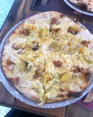 Pizza orientale vegan (potato, beyond sausage, curry, garlic) at Rifugio Romano in Rome
