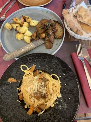 Grilled seitan (AMAZING) and carbonara  at Rifugio Romano in Rome