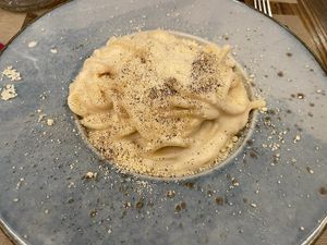 Tonnarelli cacio e pepe, pasta with vegan pecorino cheese and black pepper, deliciously creamy   at Rifugio Romano in Rome