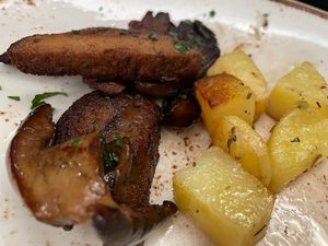 A small view of the seitan stew with porcini mushrooms and backed potatoes, the best seitan dishes ever: scrumptious and crispy   at Rifugio Romano in Rome
