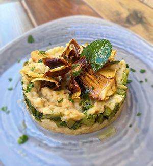 Risotto with artichokes, topinambur and cashew cream at Rifugio Romano in Rome