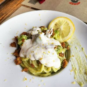 Fresh and long pasta with broccoli cream, vegan sausage and cashew stracchino at Rifugio Romano in Rome