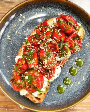Bruschetta with homemade cashew cheese, confit tomatoes and oregano and basil cream at Rifugio Romano in Rome