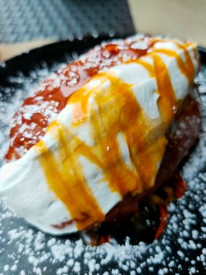 Sweet Roman bread with whipped cream and vegan homemade honey at Rifugio Romano in Rome