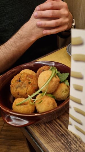 Arancino and fried olives at Rifugio Romano in Rome