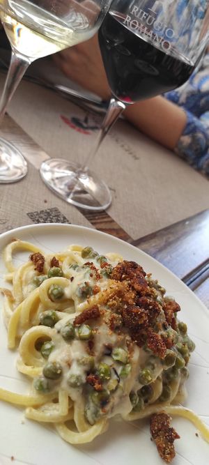 Tonnarelli alla crema di anacardi piselli e salsiccia vegana at Rifugio Romano in Rome