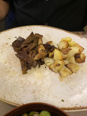 Seitan with mushrooms and potatoes  at Rifugio Romano in Rome