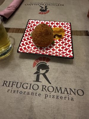 Arancino con pancetta  at Rifugio Romano in Rome