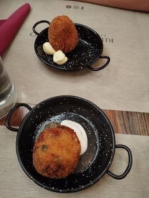Arancini: above is "sea taste" and below is classic at Rifugio Romano in Rome