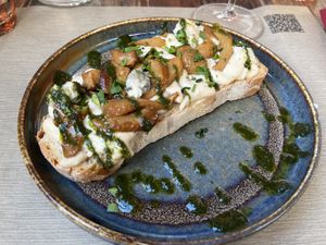 Bruschettone with cashew gorgonzola, sauted porcini mushrooms, Maldon salt and basil reduction  at Rifugio Romano in Rome