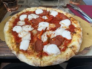 La Diavola Vegan del Rifugio (Tomato Sauce, Vegan Mozzarella Cheese, Spicy Vegan Salami, Chilli, mozzarella cream)  at Rifugio Romano in Rome