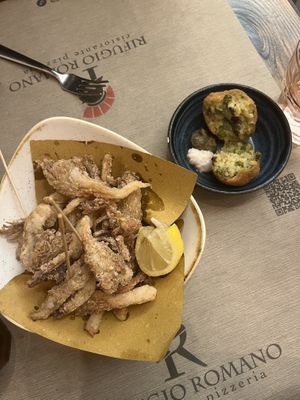 Arancini (right) and fried oyster mushrooms (left)  at Rifugio Romano in Rome