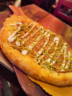 Pizza mortadella e crema di pistacchio  at Rifugio Romano in Rome