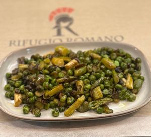 Typica roman spring side dish with Fava beans, peas and asparagus at Rifugio Romano in Rome