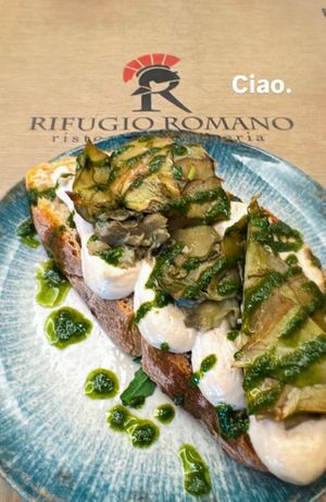 Bruschetta with roman style artichoke, homemade cashew cream cheese, mint oil. at Rifugio Romano in Rome