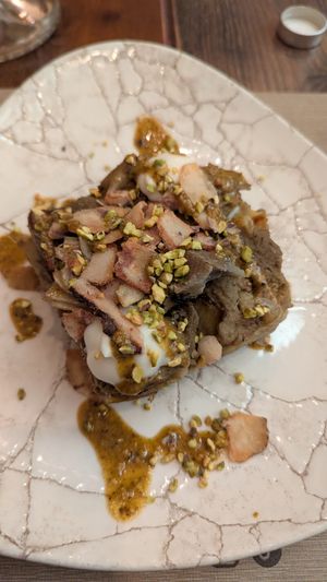 Lasagna with pistachio and artichoke, homemade jerusalem artichoke bechamel sauce and chips at Rifugio Romano in Rome