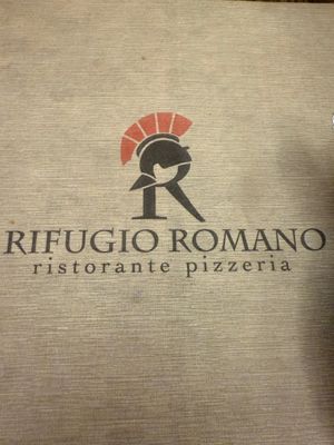 Logo: Is it a centurion helmet or a cartoon chicken? Maybe both! at Rifugio Romano in Rome