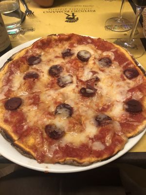 Vegan salami and mozzarella pizza at Rifugio Romano in Rome