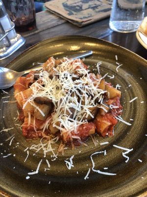 Pasta with vegan cheese and vegan bacon  at Rifugio Romano in Rome