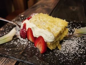 Homemade cake with cream, pineapple and strawberries at Rifugio Romano in Rome