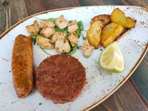 Mix grilled vegan 'meat' by Beyond Meat and This isn't chicken at Rifugio Romano in Rome