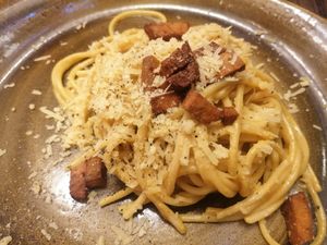 Vegan spaghetti carbanara - scrambled tofu as the base. Topped with vegan parmesan and seitan. at Rifugio Romano in Rome