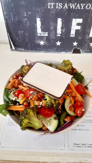 The buddha bowl with the dressing on top at Herbivore in Prague