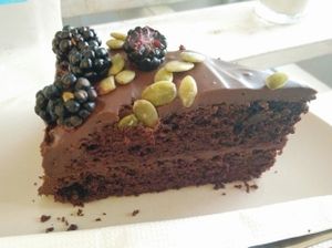 chocolate cake with blackberries and pumpkin seeds at Herbivore in Prague