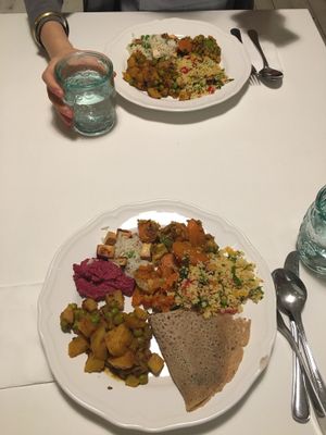 Potatoes, peas & curry; beet hummus; cous cous salad; tofu & rice; vegetable crepe. So delicious! at Herbivore in Prague