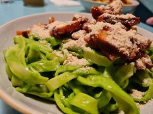 Tagliatelle with spinach sauce, baked, smoked tofu, sundried tomatos and cashew parmesan at Herbivore in Prague