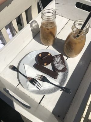 Iced coffee with peanut butter cup, vegan bounty and twix ☺️ at Herbivore in Prague