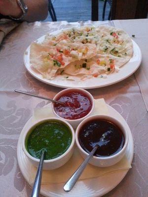 Papadums with vegetables and sauses at Indian Raja in Riga