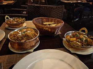 Chana masala, potato naan, mushroom rice and aloo gobi. All delicious. at Indian Raja in Riga