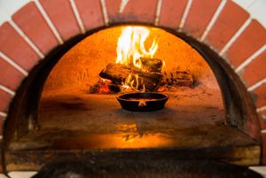 Shakshuka preparation at Pitarija Fire Place in Vilnius