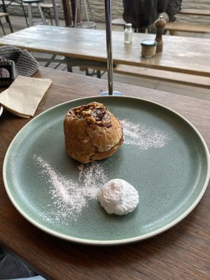 Sticky Cinnamon Almond Bun with coconut cream   at Bespoke Kitchen  in Queenstown