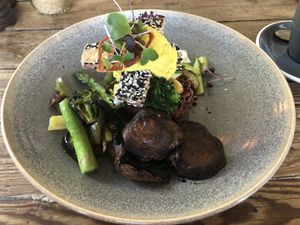 winter greens vegan benedict (gf) —
kumara, nori & agria rosti, 
crispy sesame tofu, mushrooms, 
hazelnut vegan hollandaise  at Bespoke Kitchen  in Queenstown