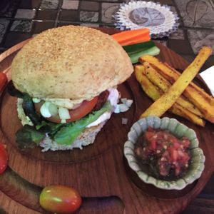 peanut butter and chickpea burger with chips  at Karma Kitchen in Chiang Mai