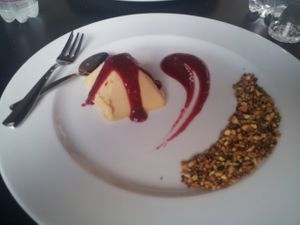 Peach semi-freddo with raspberry sauce and toasted nuts at Mia in Modena