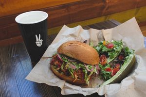 Jackfruit carnitas, pepitas, avocado, salsa morita, radish, lettuce, pickled onions, house vin, on a Hawaiian bun  at Even Stevens Sandwiches in St George