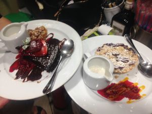 vegan chocolate cake and vegan summer fruit crumble with soy cream at Chiccas in Praia Da Luz